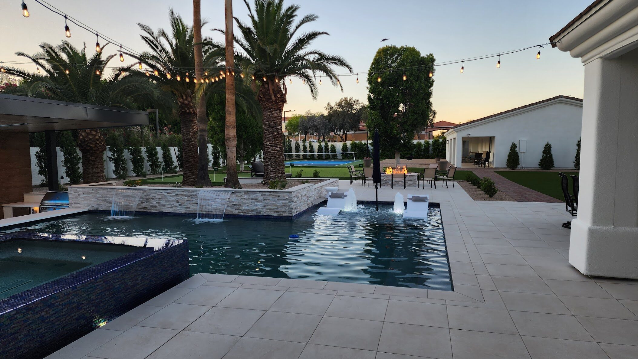 Paradise Valley luxury resort-style pool with multiple water features and outdoor kitchen